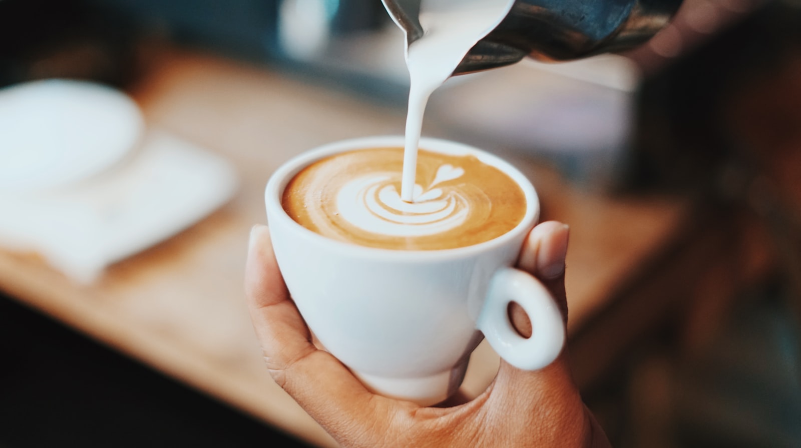 Milk poured into a cappuccino