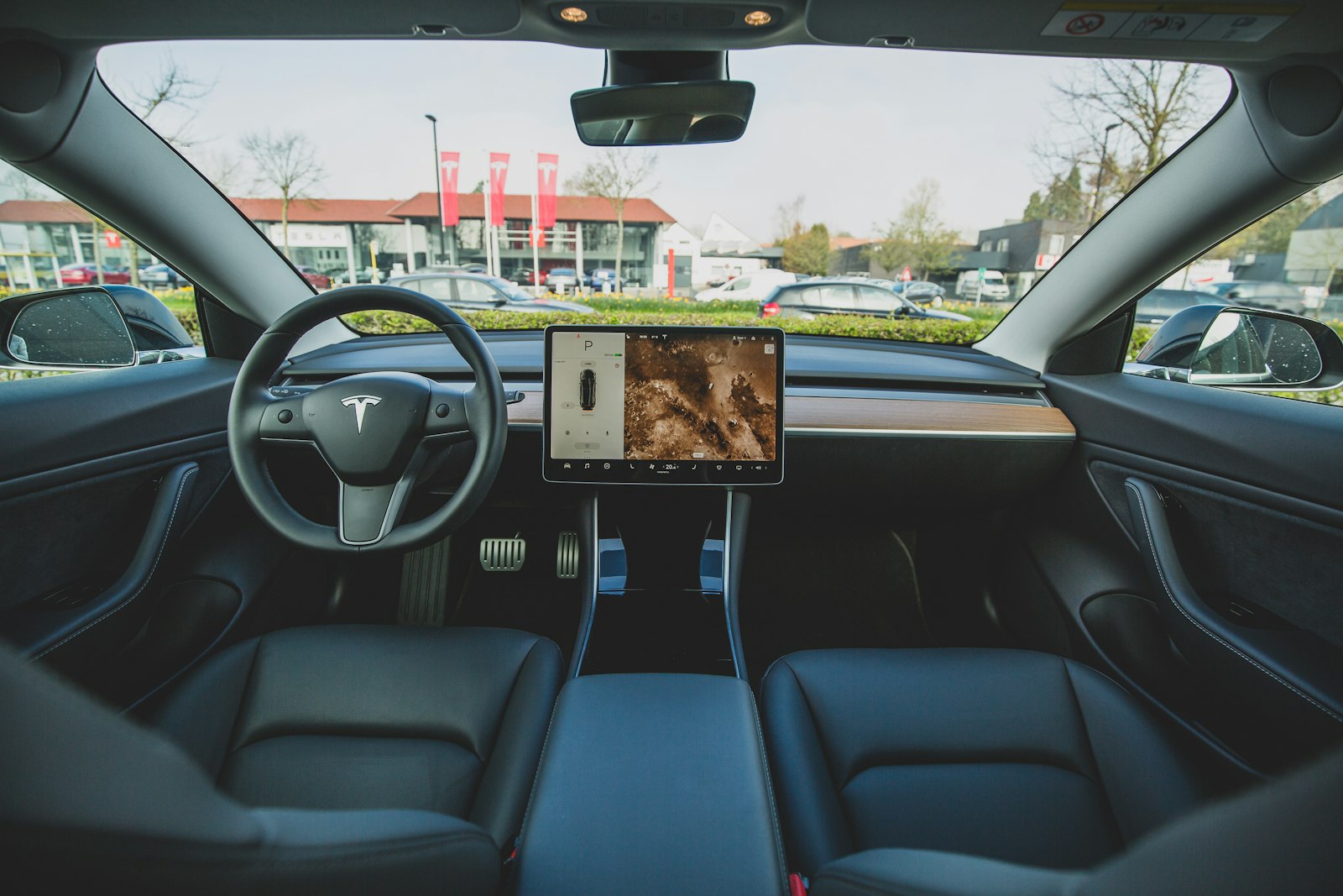 An electric car interior with a central touchscreen