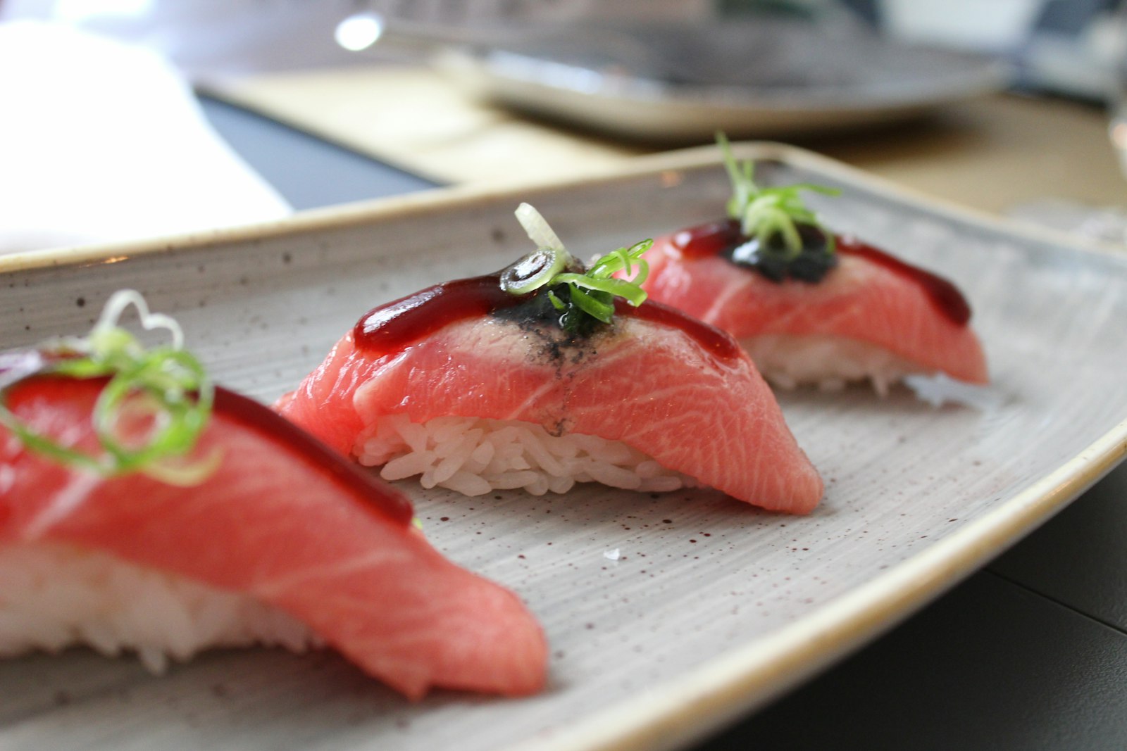 Glazed tuna nigiri with scallion