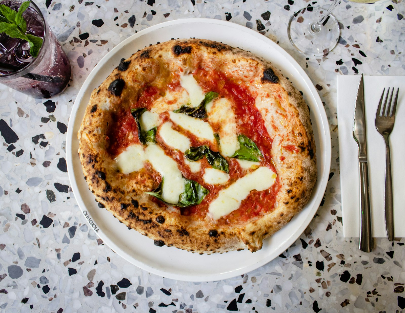 A margherita from above on a terrazzo table