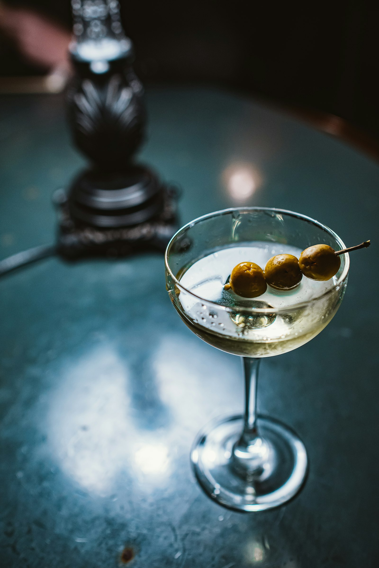 A martini with three olives
