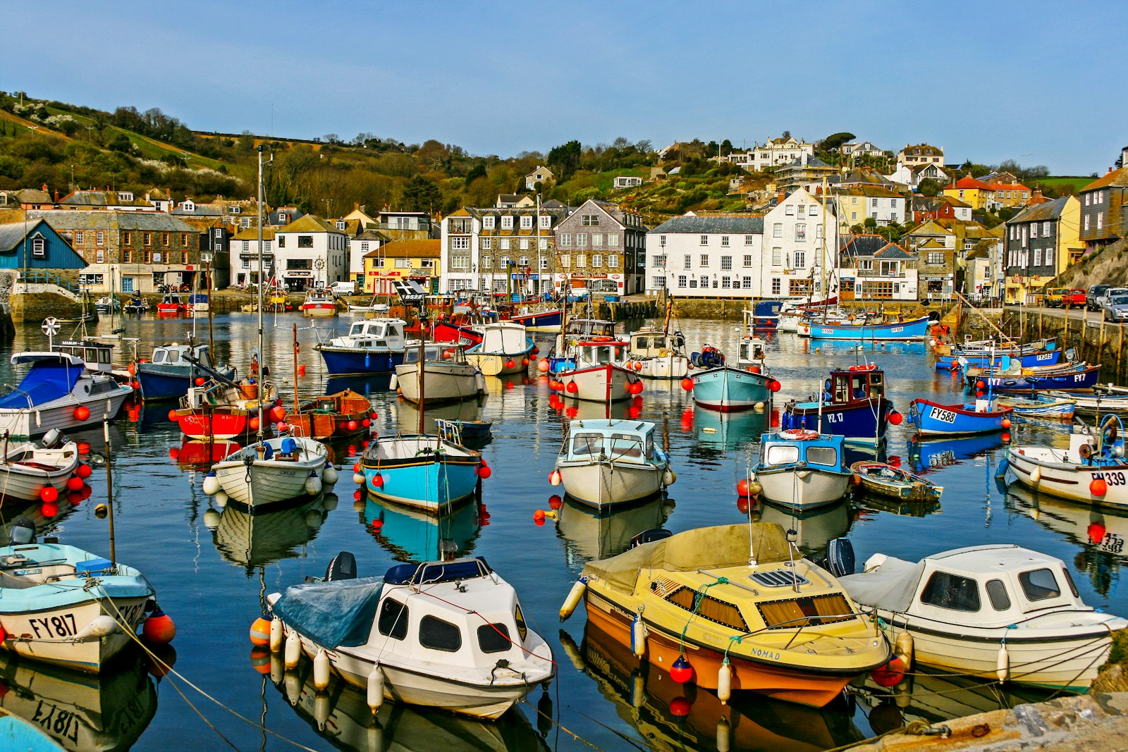 A small harbour packed with colourful boats