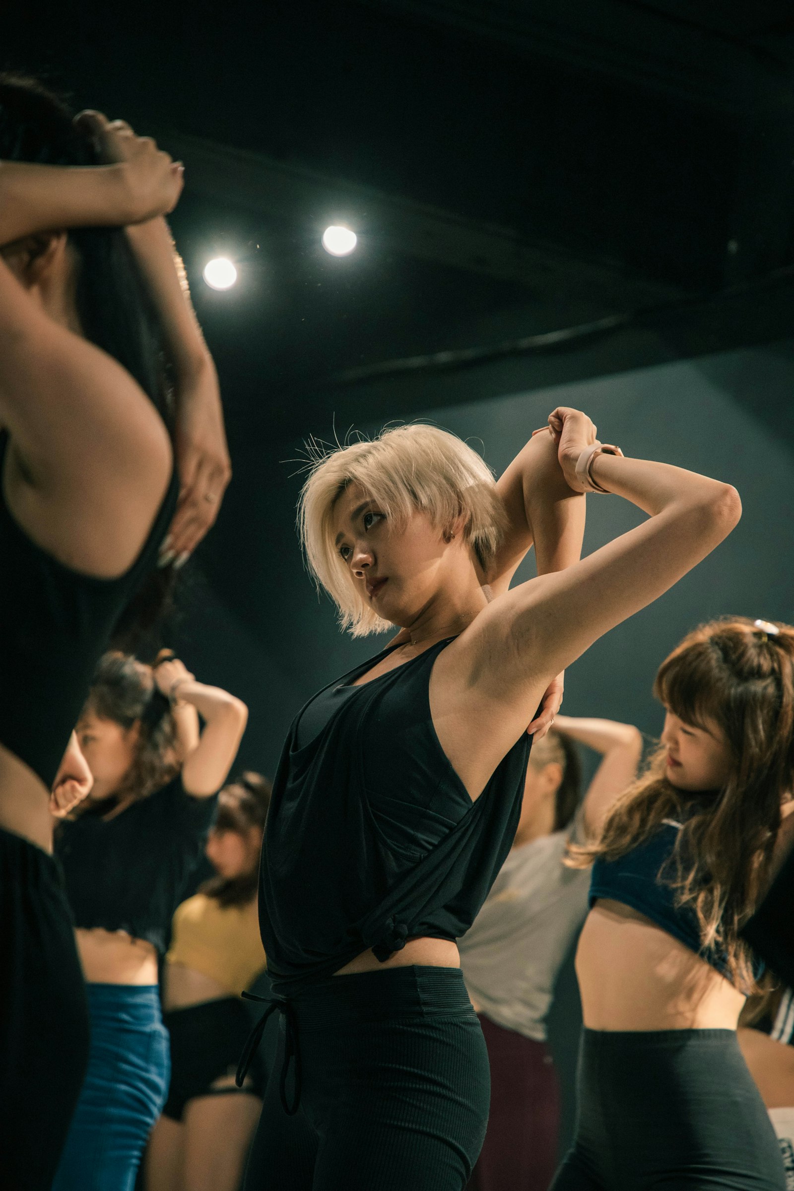 A contemporary class under stage light