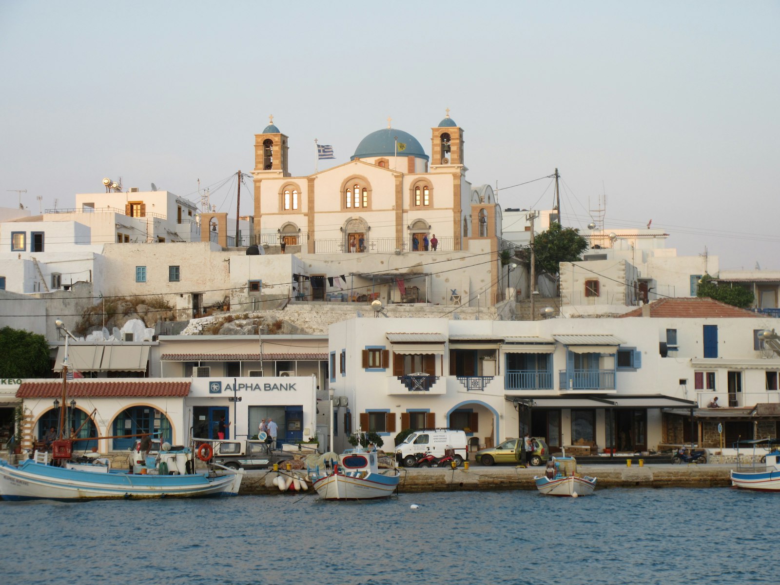 A Greek island harbour with whitewashed houses