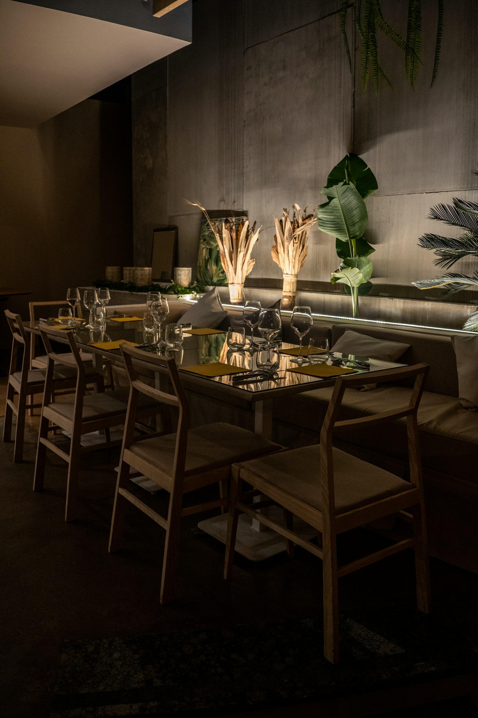 A low-lit dining room with set tables