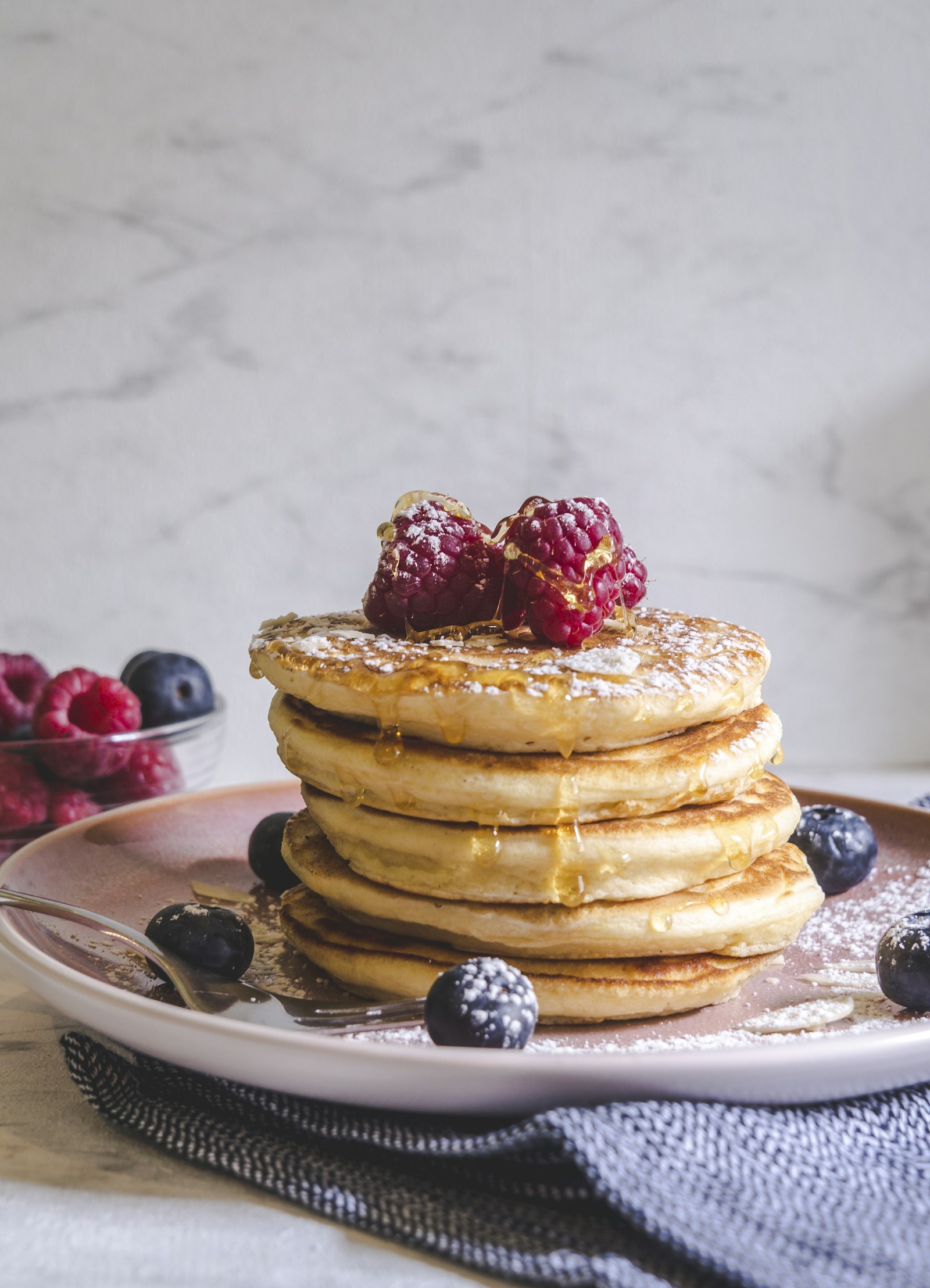 A stack of pancakes with berries