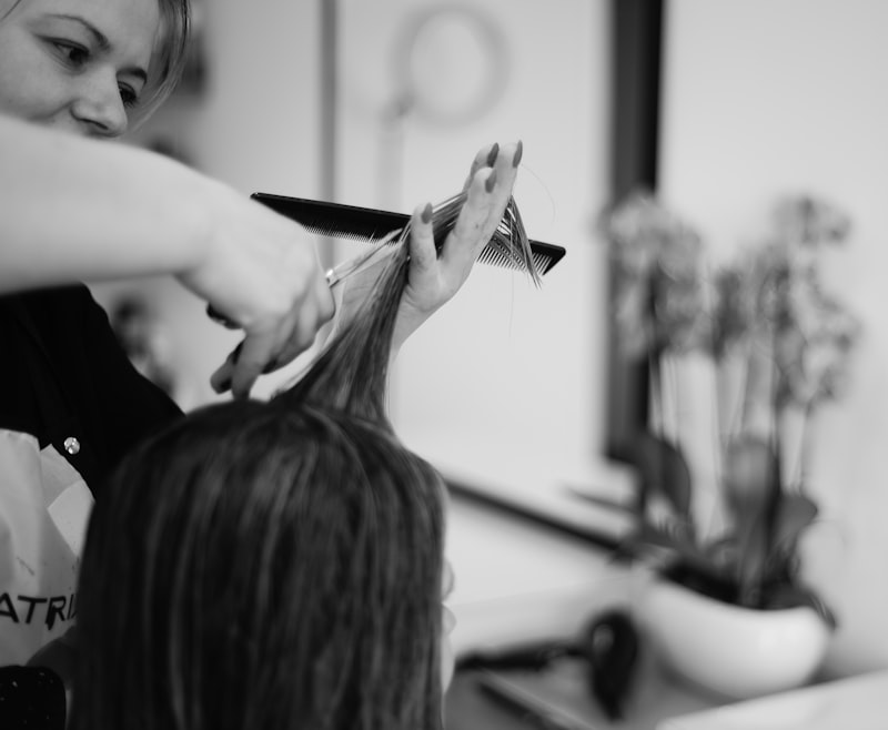 A stylist cutting a client's hair
