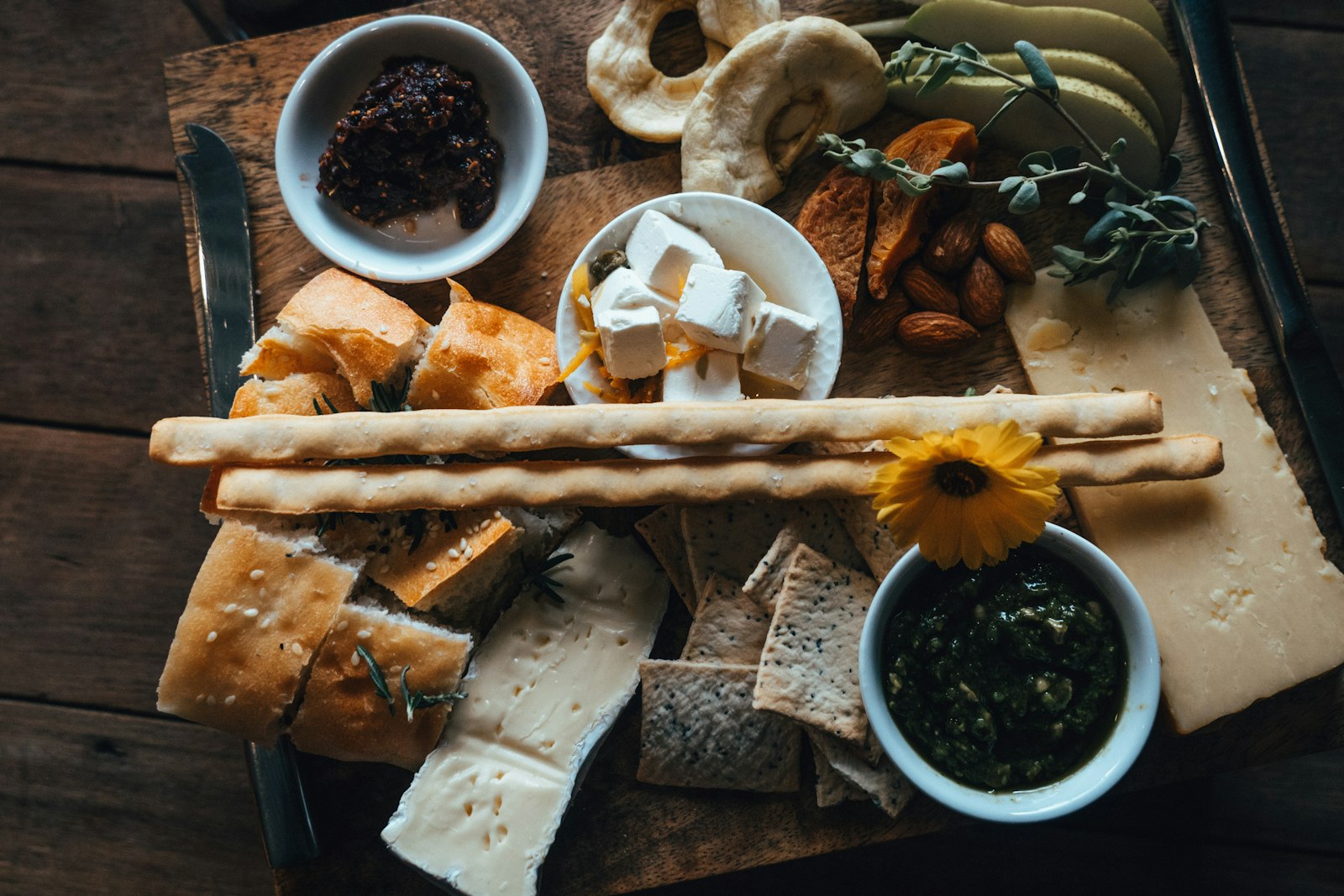 A grazing board with cheeses and bread