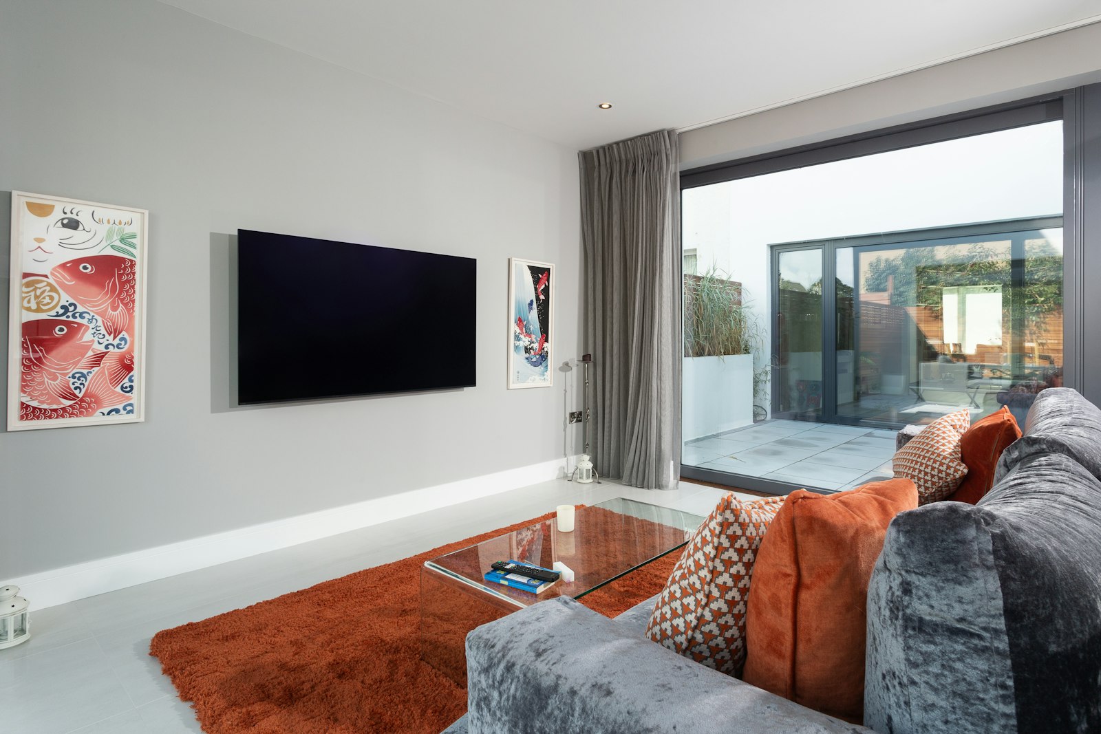A show-home living room opening onto the garden