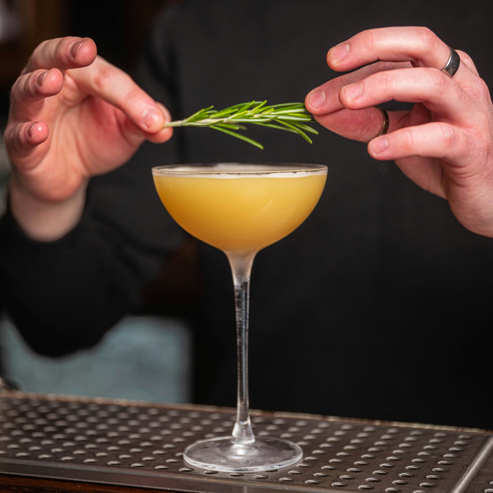 A rosemary sprig laid across a coupe