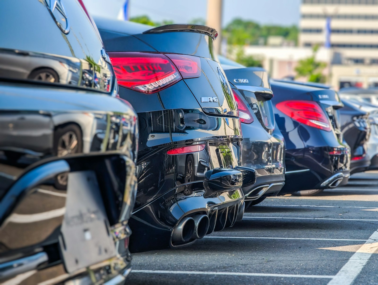 A row of clean hatchbacks parked at the depot