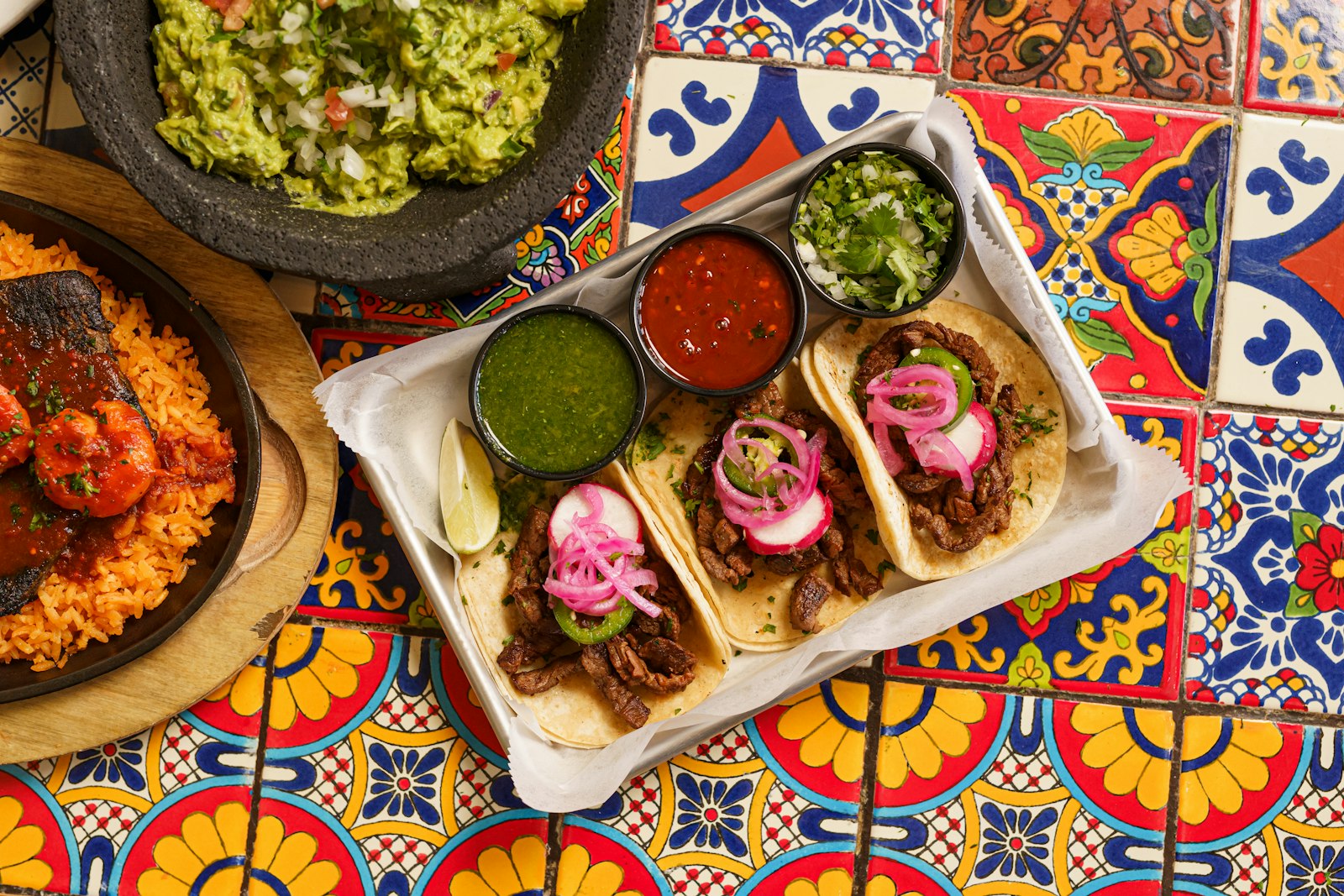 Tacos and salsas on a talavera tile table