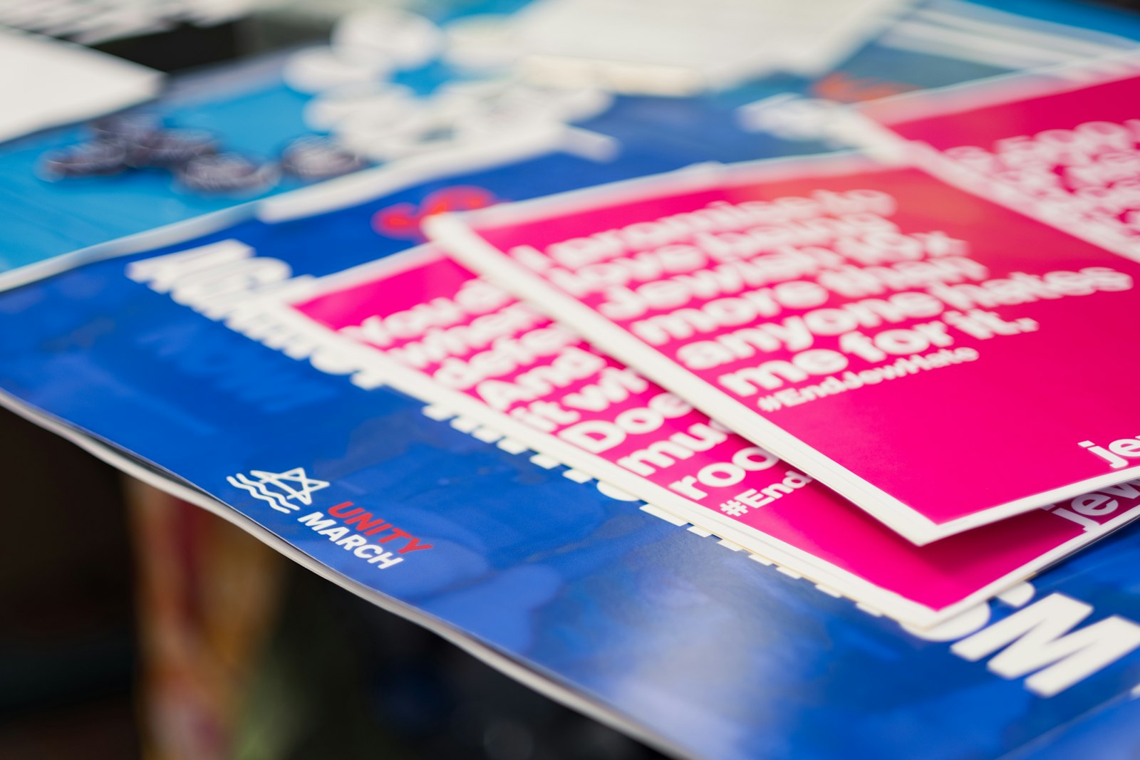 Pink and blue printed stickers and cards on a table