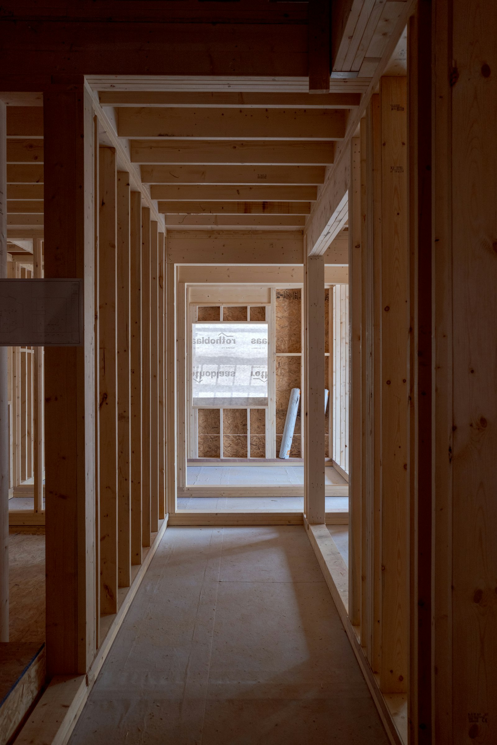 A timber-lined corridor with exposed beams
