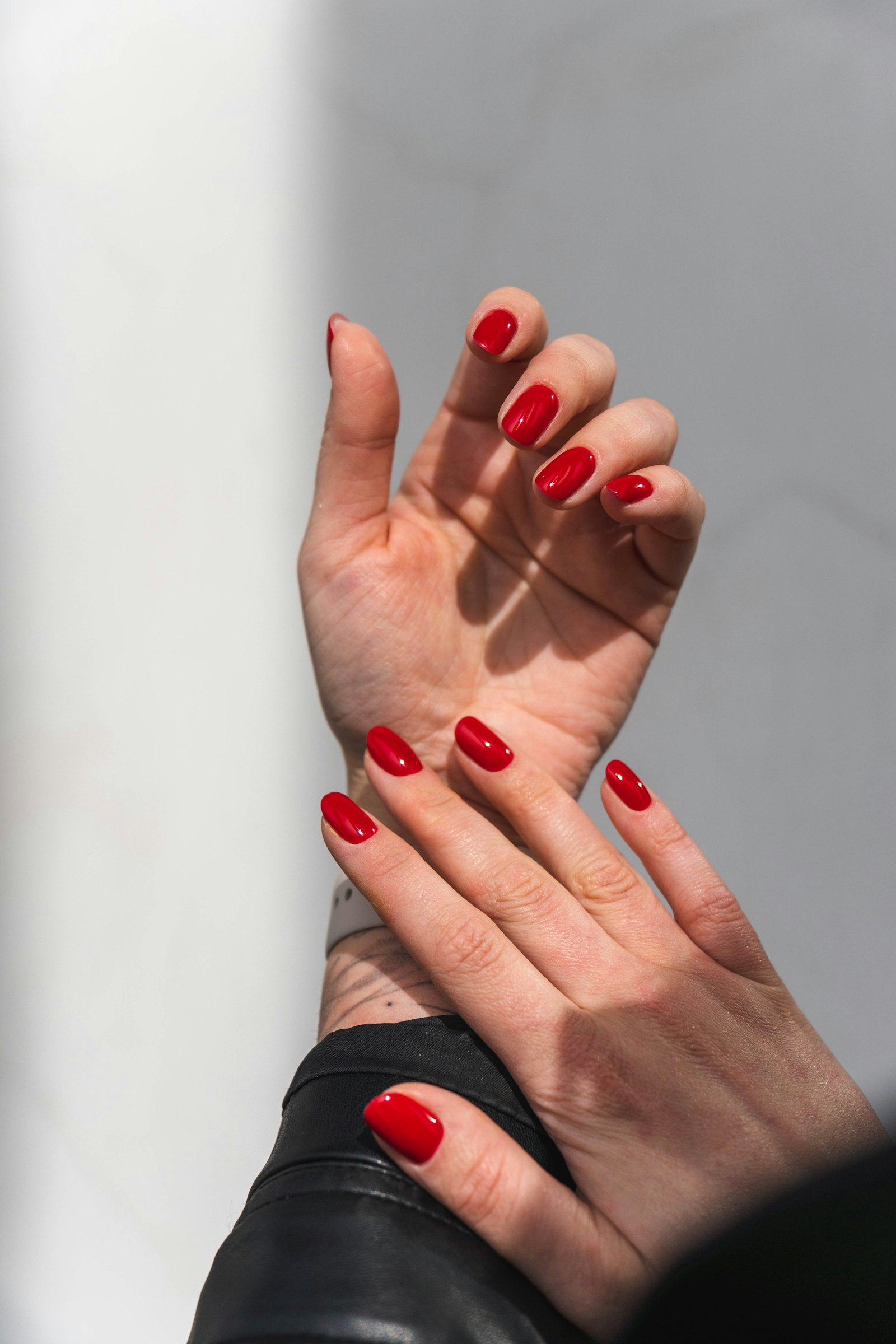 Red painted nails on a hand