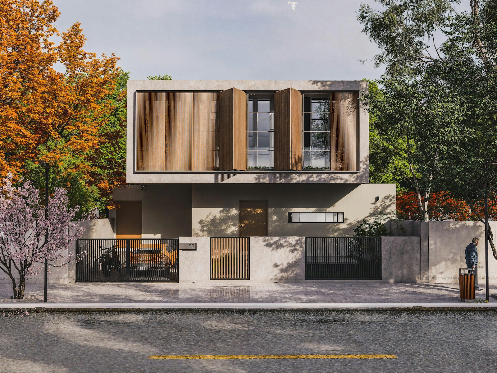 A concrete house with a timber-slatted upper floor among autumn trees