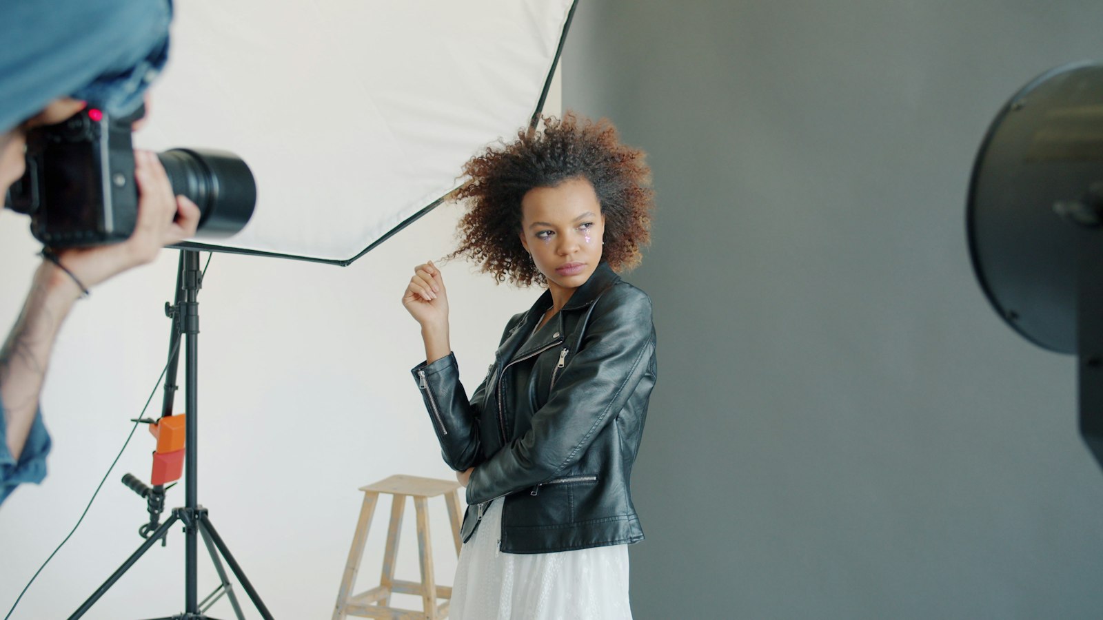 A model posing under studio lighting