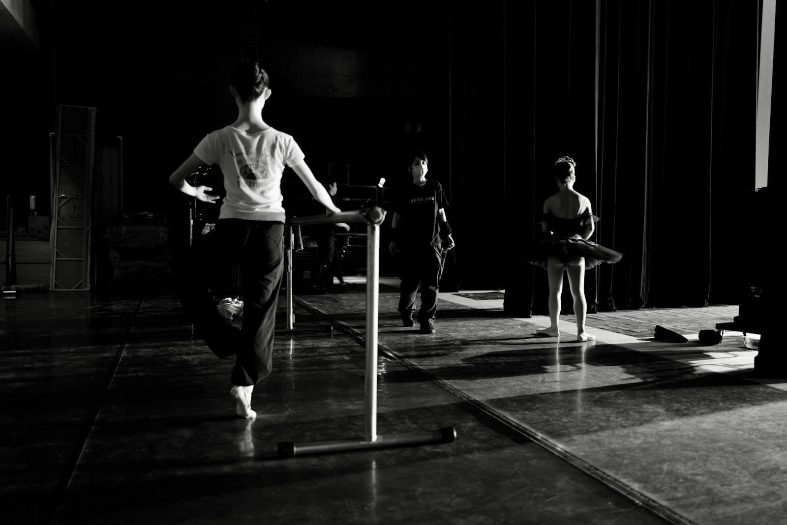 Ballet students at the barre, black and white