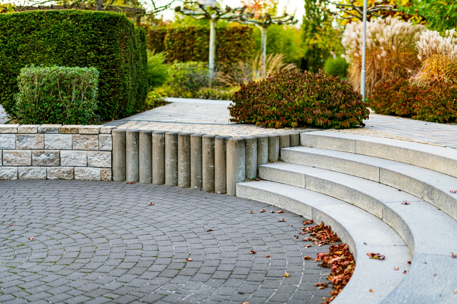Curved stone steps leading up through a planted garden