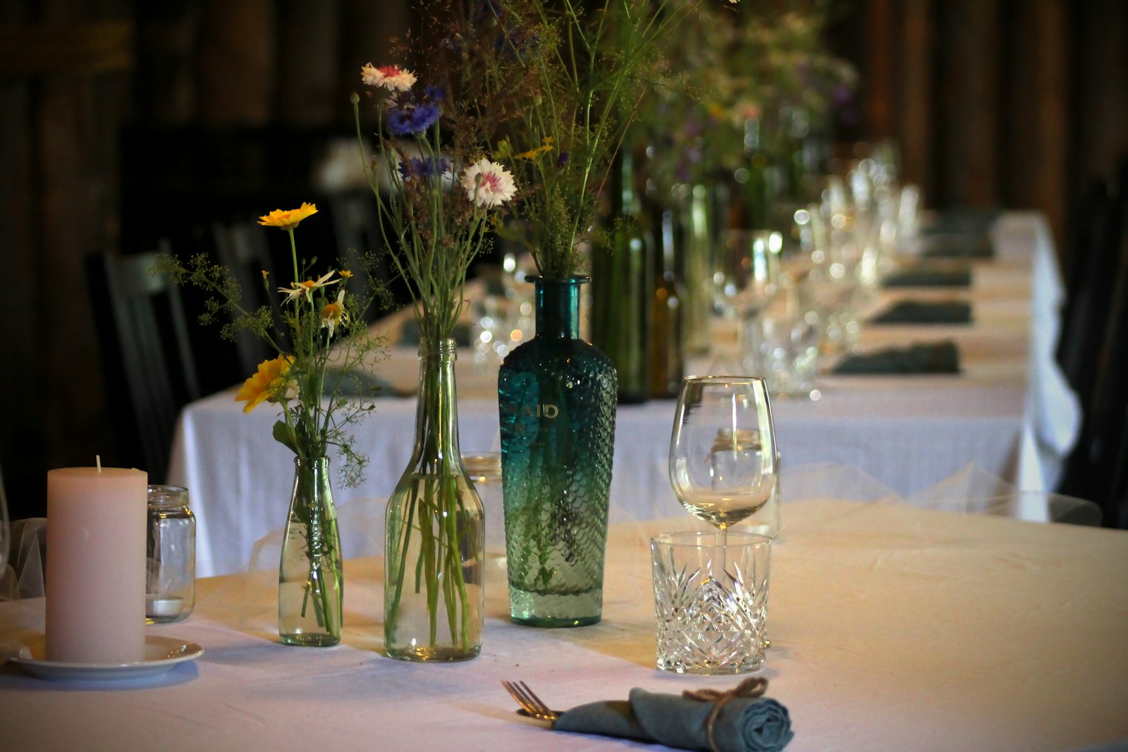 A rustic table with wildflowers